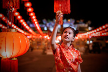 Little Asian Girl In Chinese Traditional Red Dress With Red Lantern Background, Chinese New Year