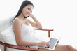 © u photostock - Asia woman sitting on the chair in morning with laptop