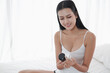 © u photostock - Portrait mini sexy asia woman review cosmetics live web camera online concept