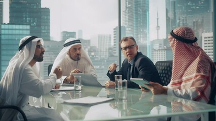 Wall Mural - International Business Consultant Advices on Diversification of Investment Portfolio to Successful Arab Company Owners. Multicultural Meeting in Modern Office Between American and Emirati Businessman