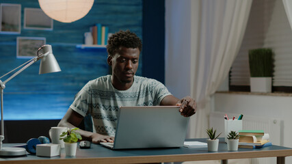 Poster - Business man working from home with laptop at desk. Entrepreneur using modern device for online remote work on internet connection. Professional worker doing project with gadget