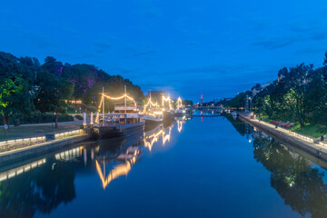 Poster - Turku, Finland - August 5, 2021: Night view on Aurajoki river with illuminated ships.