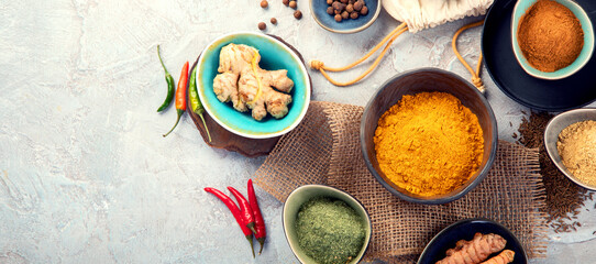 Poster - Assortment of Indian spices on gray background.