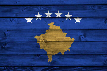 Flag of Kosovo on wooden surface