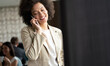 © NDABCREATIVITY - Beautiful african corporate worker talking on mobile phone