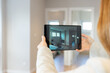 Real estate agent conducts virtual tour to show a property to clients via video call. High quality photo
