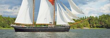 An Elegant Two-masted Gaff Schooner (training Tall Ship) Sailing In Mälaren Lake, Sweden. Travel, History, Traditions, Transportation, Sailing, Sport, Cruise, Regatta, Teamwork. Panoramic View