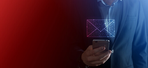 Businessman hand holding e-mail icon, Contact us by newsletter email and protect your personal information from spam mail. Customer service call center contact us concept