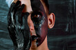 © Denis - Portrait of a young man with unusual makeup. The guy is posing without a T-shirt. Black paint on the face.