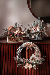 Wall Mural - Christmas decorations on furniture, round decorative wreath,