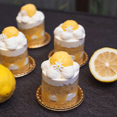 Wall Mural - Lemon layer cake with lemon curd and fresh cream decorated like daisy flower