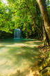 beautiful waterfall in nature,Beautiful waterfall in green forest in jungle,Erawan waterfall