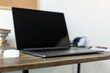 © Svitlana - Laptop or notebook on table in office.  Workplace for online study