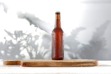 Wall Mural - Natural wooden table with a blank background of shadows on the wall 