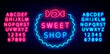 Sweet shop neon sign with candy. Night bright alphabet on brick wall background. Isolated vector illustration