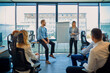 © Westend61 - Businesswoman leading a presentation at flip chart in office