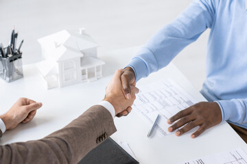 Poster - Directly above view of unrecognizable blackman handshaking with bank specialist after signing loan papers