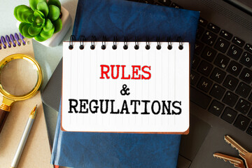 Poster - Torn brown paper on green surface with Rules and Regulations words.