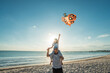 © Odua Images - happy dad and daughter flying kite together at the beach