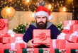 © be free - Man bearded santa claus hat celebrate new year. Generous new year. Lot of gifts. Hope for the best. Wrapped gifts with ribbons and bows. Hipster prepared gifts for family. Happy winter holidays