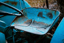 Rusty Blue Seat Of Abandoned Tractor