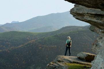 Person on the top of the mountain