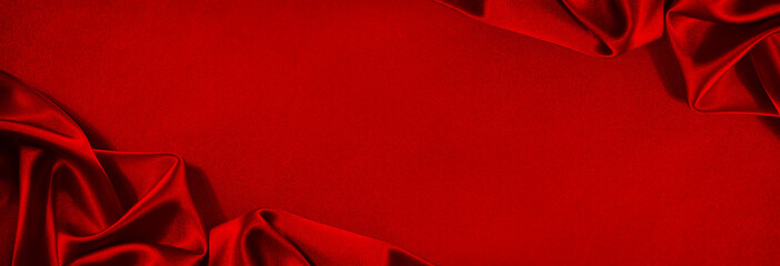 beautiful red silk satin background. soft folds on shiny fabric. luxury background with copy space f