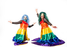 Cheerful Drag Queens Dancing Over White Background