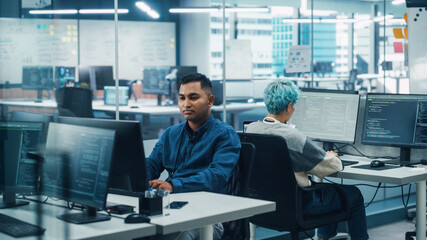 Wall Mural - Diverse Body Positive Office: Woman with Disability Using Prosthetic Arm, Indian Professional, Non-Binary Specialist Work on Desktop Computers. Talentend Successful People Creating Innovative Product