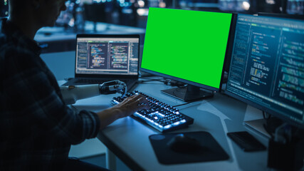 Aufkleber - Night Office: Person with Disability Using Prosthetic Arm to Work on Green Screen Chroma Key Computer. Swift and Natural Use of Myoelectric Bionic Hand To Type Code for Software at Night.