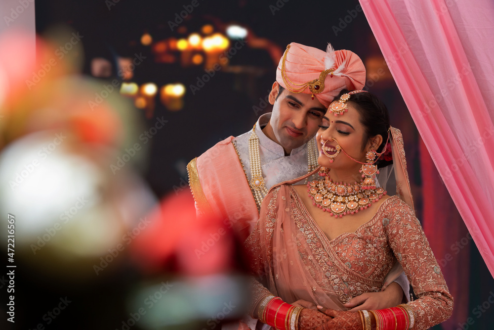 Portrait of an Indian wedding couple posing for album Stock Photo ...
