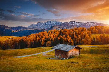 Farmhouse on the slopes of the Compaccio village. Dolomite alps, Alpe di Siusi, South Tyrol, Italy, Europe.