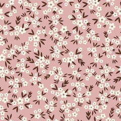 Vintage floral background. Seamless vector pattern for design and fashion prints. Floral pattern with small white flowers and brown leaves on a pink background.