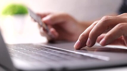 Poster - Hands holding credit card, typing on laptop keyboard, online shopping concept
