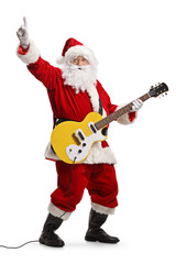 Canvas Print - Santa claus playing an electirc guitar and pointing up