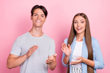 Sticker - Photo of charming pretty young couple wear casual clothes smiling applauding isolated pink color background