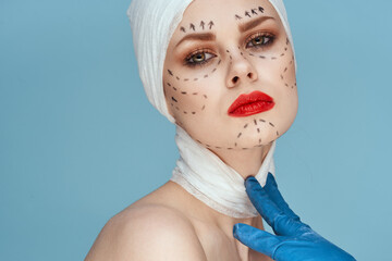 Poster - portrait of a woman posing in blue gloves red lips surgery facial rejuvenation studio lifestyle