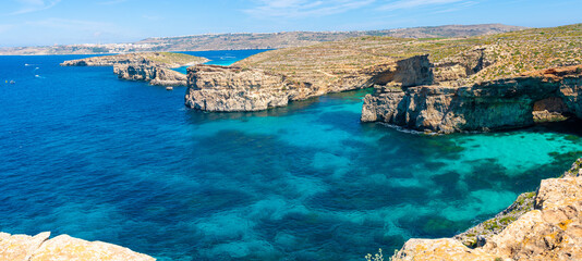 Wall Mural - Stone cliffs on the blue lagoon of the island of Comino and Gozo Malta. Mediterranean Sea