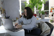 © Olga Tkacheva - Adult woman working at home at the computer in home clothes