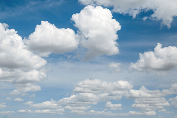Wall Mural - white, fluffy clouds in blue sky. background from clouds.
