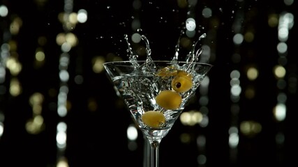 Aufkleber - Super slow motion of falling olives into cocktail drink, camera movement. Filmed on high speed cinema camera, 1000 fps.