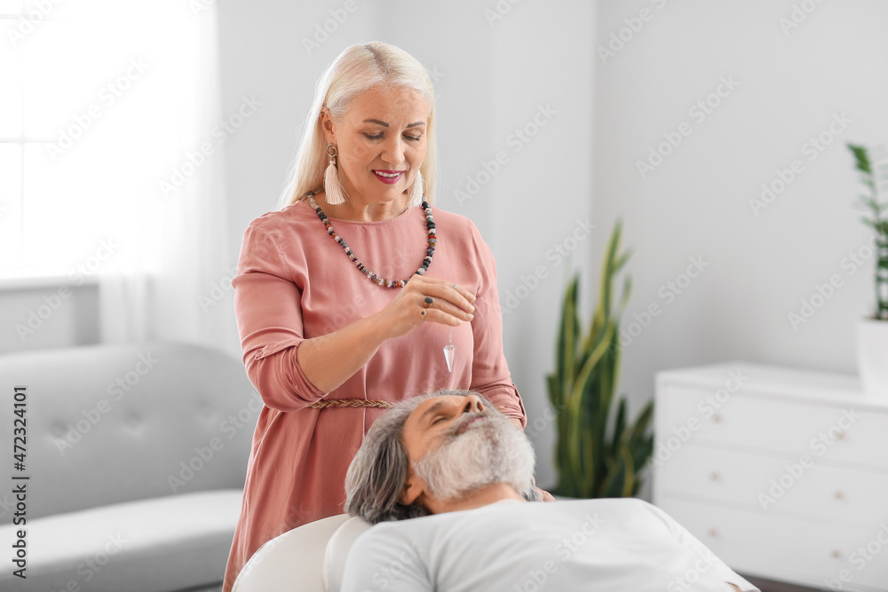 Reiki master working with patient
