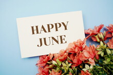 Happy Junetext With Flower Frame On Blue Background