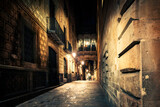 Fototapeta Uliczki - Gothic quarter at night. Empty alleyways in Barcelona. Bridge between buildings in Barri Gothic quarter of Barcelona, Catalonia, Spain