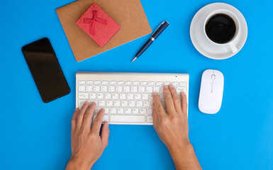 Poster - Top view of a businessman working on a desk in an office and the new regular working environment