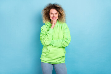 Wall Mural - Photo of smart intelligent lady finger chin beaming smile wear green sweatshirt isolated pink color background