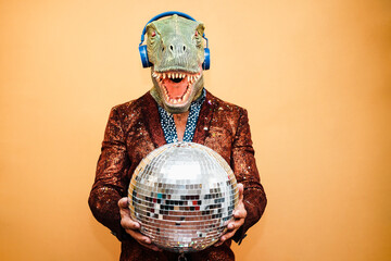 Poster - Crazy happy man dancing disco music wearing t-rex mask - Party concept - Focus on face