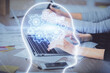 © peshkova - Multi exposure of woman hands working on computer and brain hologram drawing. Ai concept.