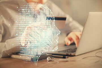 Double exposure of man hands typing on computer with credit card and brain theme drawing. E-commerce and AI concept.