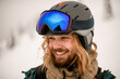 © fesenko - Portrait of joyful man skier wearing ski helmet with goggles